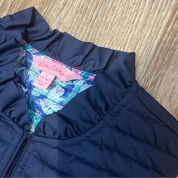 Lilly Pulitzer, Girls Blue Puffer Vest with Ruffle Trim and fringe bottom, SizeL